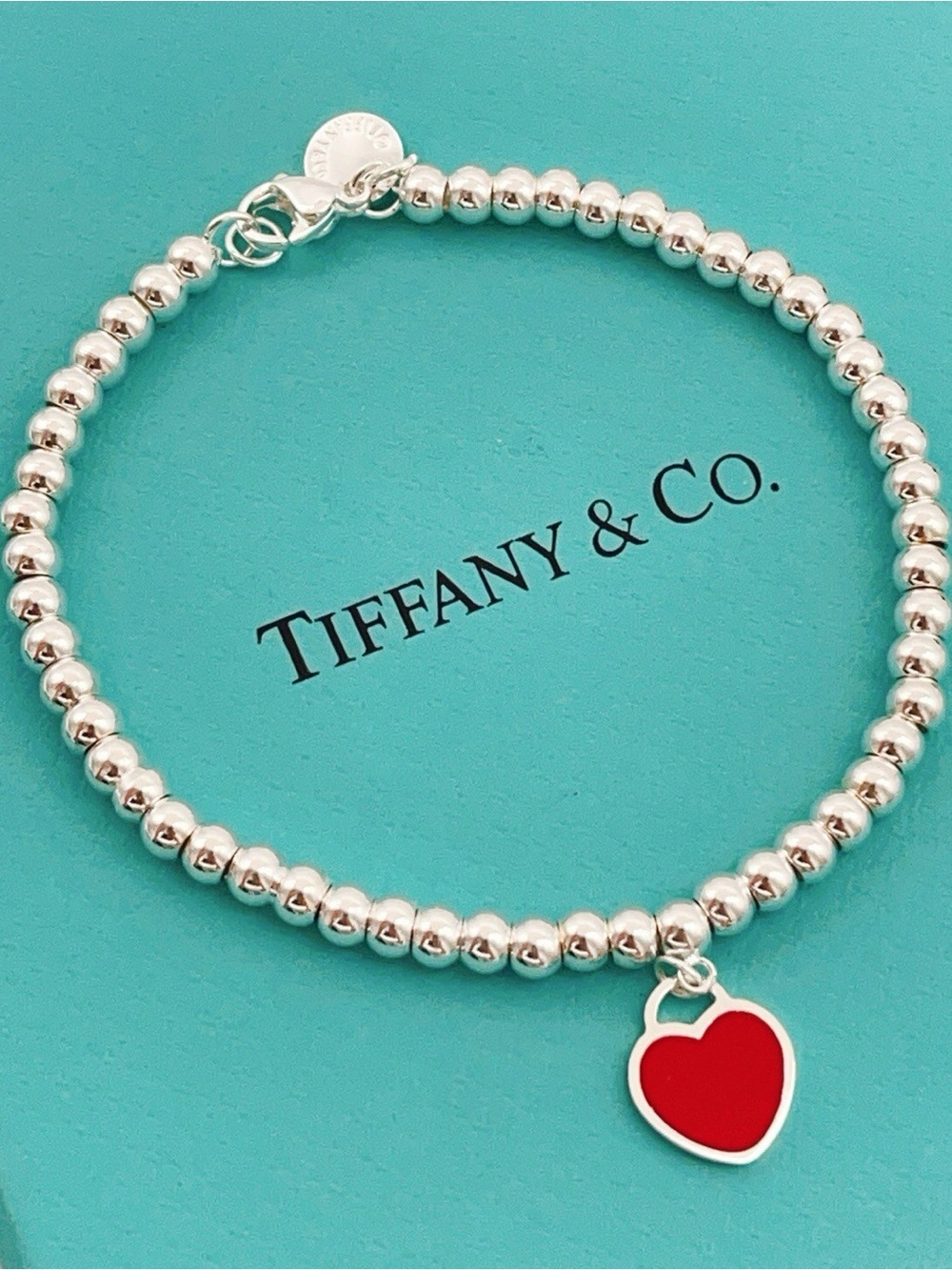 Tiffany & Co. Silver Beaded Bracelet with Red Heart Charm